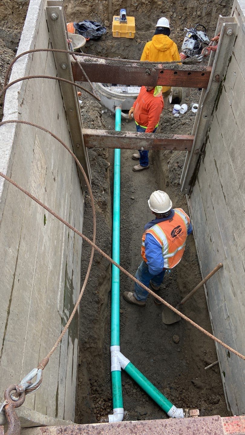 A temporary trench box placed for shoring safety while utilites are installed.