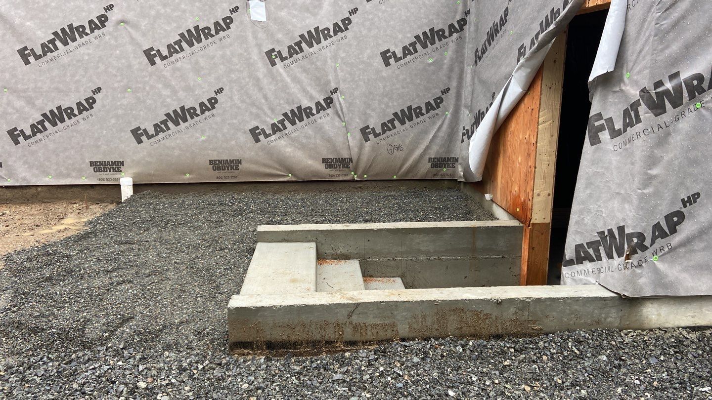 New basement entry concrete stairs.